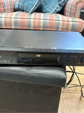 Sony black DVD/CD player with front-loading tray and control panel